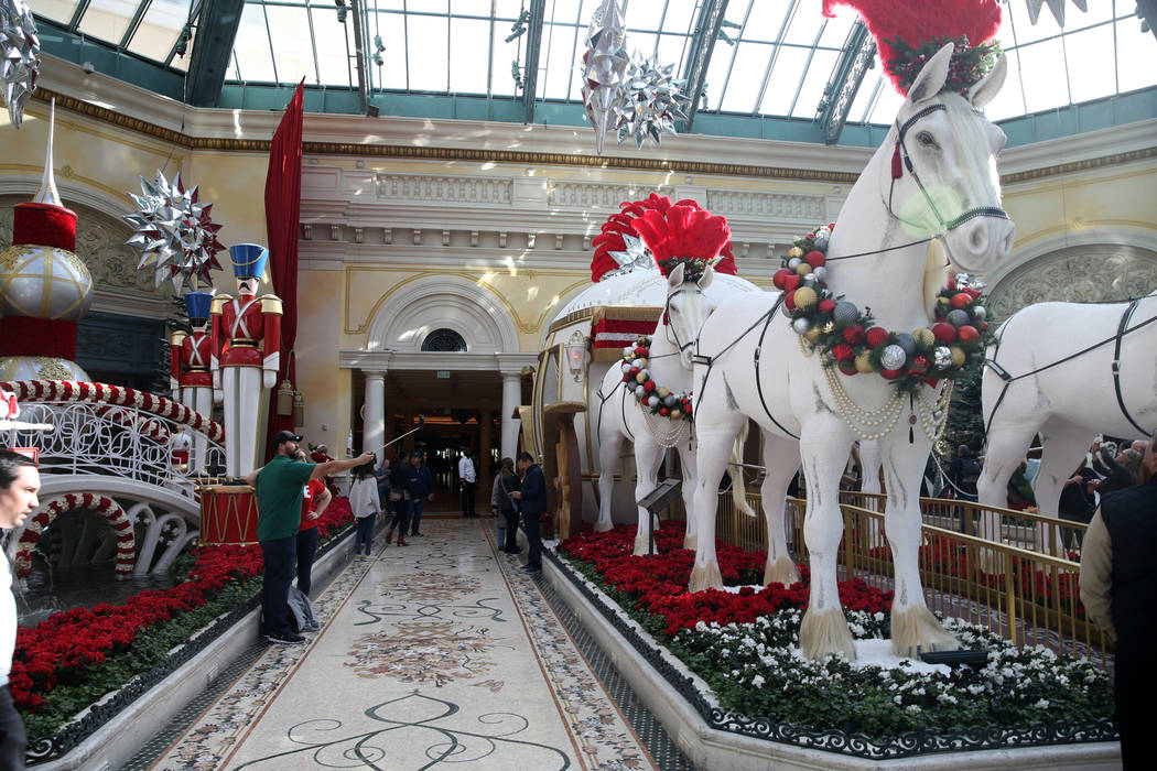 Guests check out the Majestic Holiday Magic at the Bellagio Conservatory & Botanical Gardens in ...