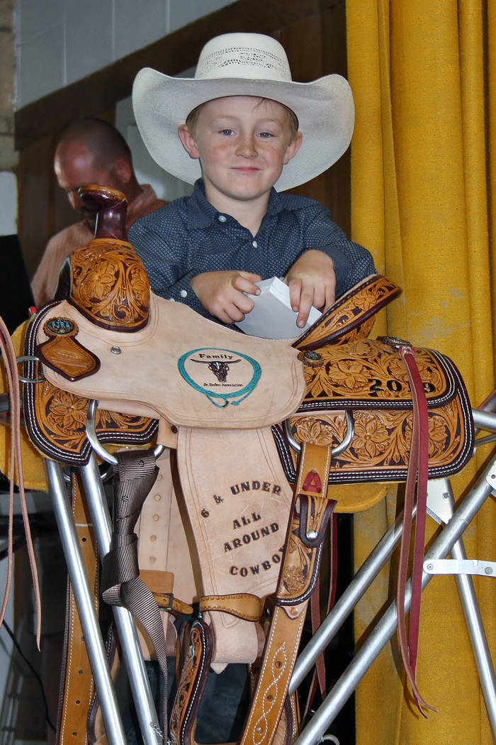 Max Henderson with his trophy saddle that he was awarded on June 2, 2019, for winning the Famil ...