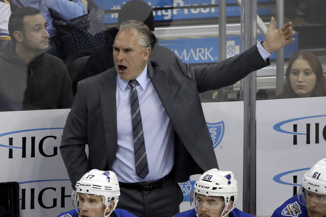 St. Louis Blues coach Craig Berube gives instructions during the third period of an NHL hockey ...