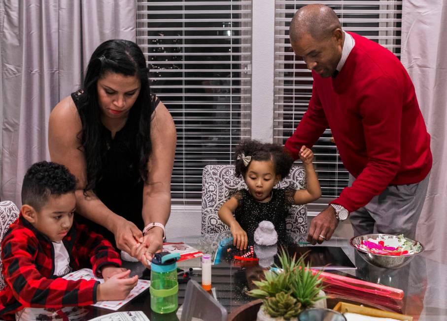 Dr. Sheldon Jacobs, right, daughter Arianna, 3, wife Nicole and son Jayden, 6, make holiday dec ...