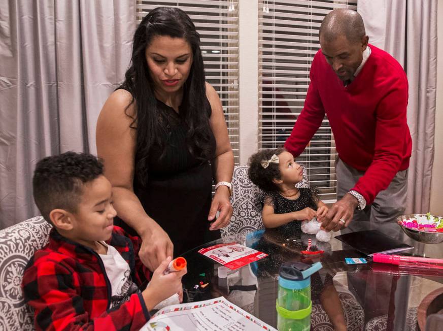 Dr. Sheldon Jacobs, right, daughter Arianna, 3, wife Nicole and son Jayden, 6, make holiday dec ...