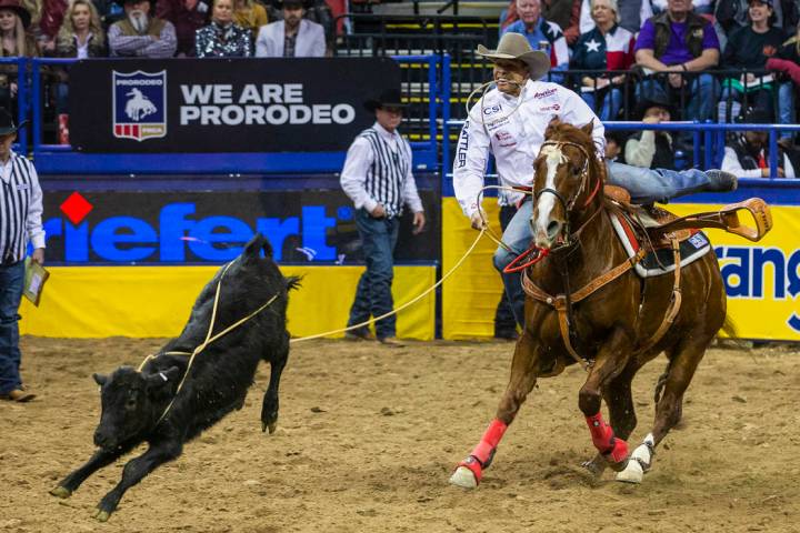 Shad Mayfield of of Clovis, N.M., eyes a roped calf in Tie-Down Roping during the sixth go roun ...