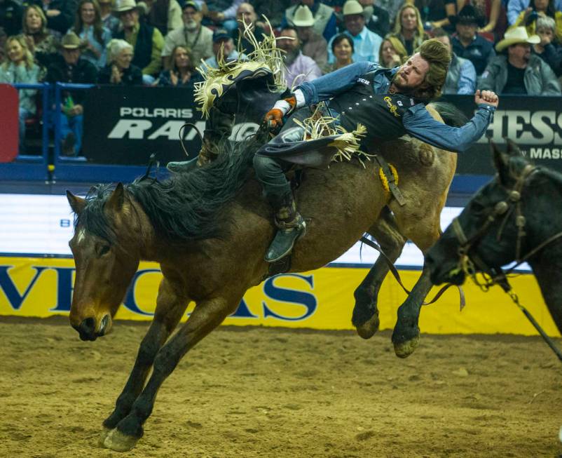 Tilden Hooper of Carthage, Texas, rides Ain't No Angel in Bareback Riding to a first-place tie ...