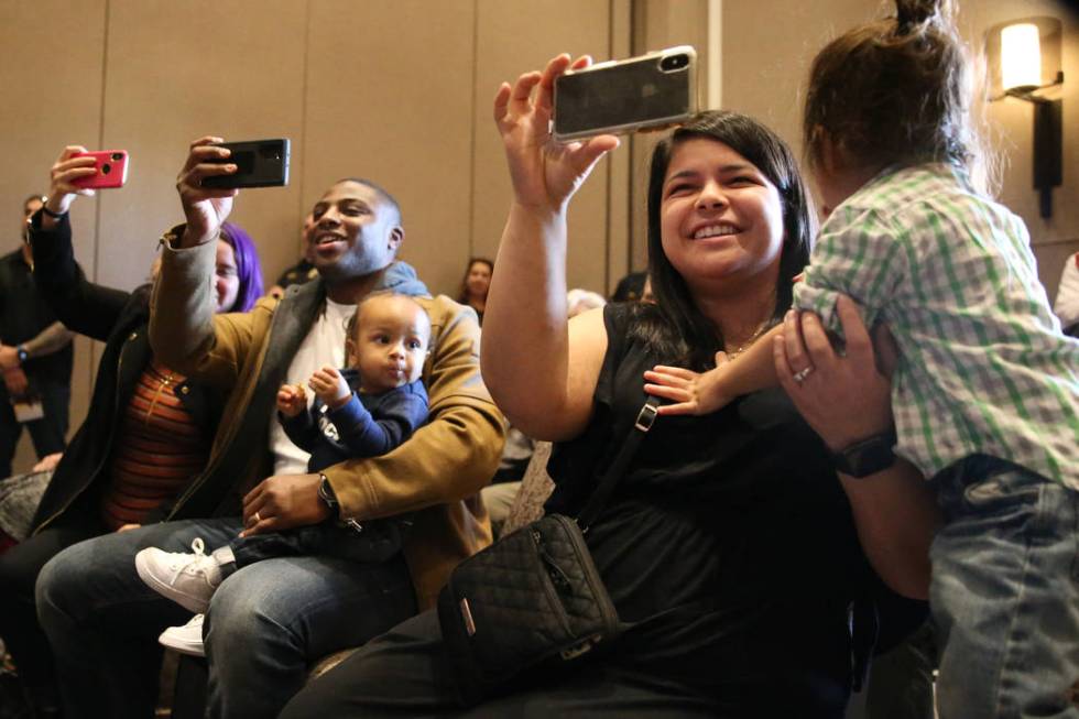 Courtney Funtila, right, with her son Parker, 2, watches her friend Julian Diaz get pinned duri ...