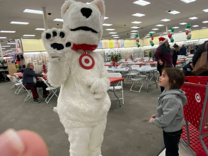 A child participating in North Las Vegas police's Shop with a Cop program Wednesday morning mar ...