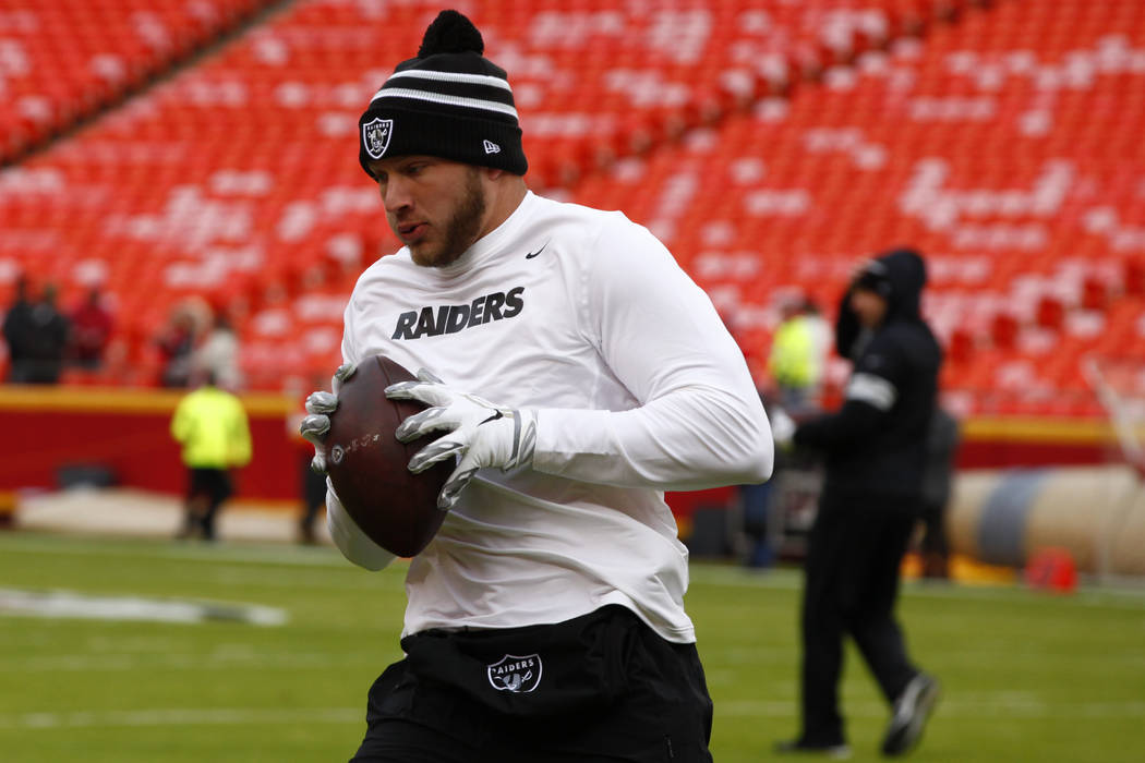 Oakland Raiders tight end Foster Moreau catches the football during pregame warmups before an N ...