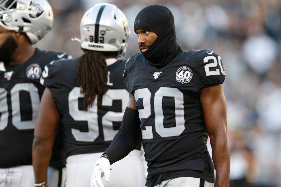 Oakland Raiders cornerback Daryl Worley (20), defensive tackle P.J. Hall (92), and defensive ta ...