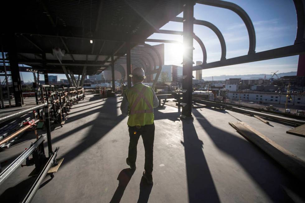 Terry Miller, owner representative with Cordell Corporation, leads a tour of the new expansion ...