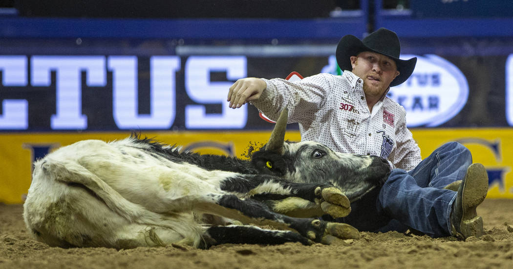 Stetson Jorgensen of Blackfoot, Idaho, looks up with tongue out following a first place time of ...