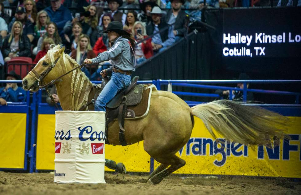 Hailey Kinsel of Cotulla, Texas, rounds a barrel on the way to a first place time of 13.60 seco ...