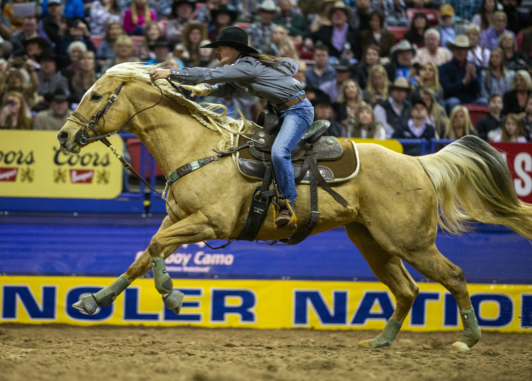 Hailey Kinsel of Cotulla, Texas, heads for home on the way to a first place time of 13.60 secon ...