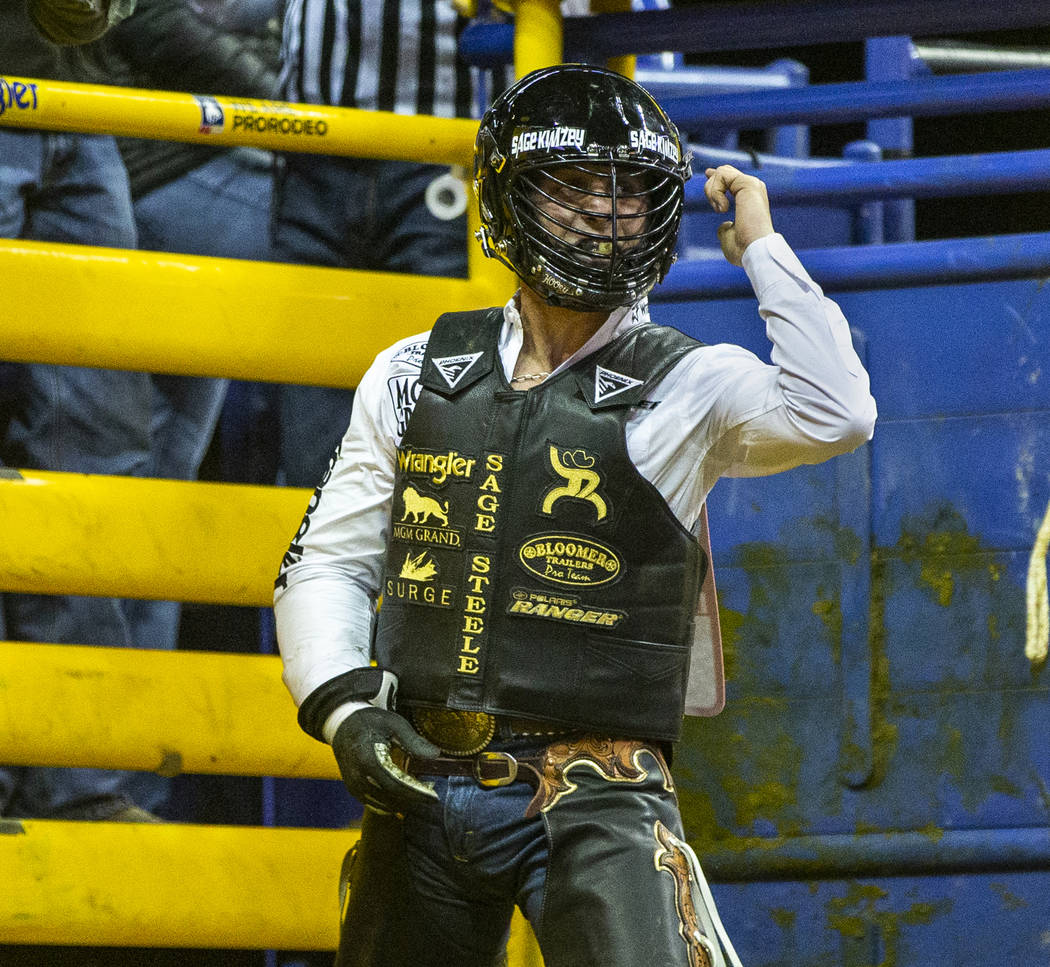 Sage Kimzey of Strong City, Okla., is pumped up after a first place score of 90 points atop of ...