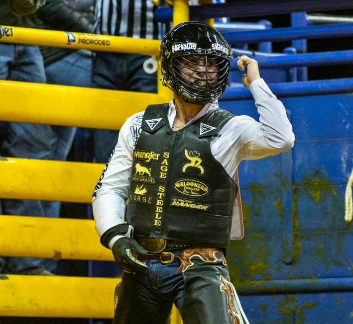 Sage Kimzey of Strong City, Okla., is pumped up after a first place score of 90 points atop of ...