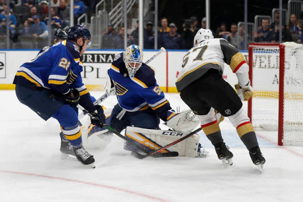 Vegas Golden Knights' Max Pacioretty, right, scores past St. Louis Blues goaltender Jordan Binn ...