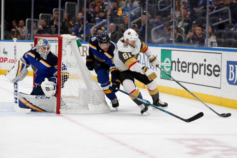 Vegas Golden Knights' Jonathan Marchessault (81) reaches for a puck as St. Louis Blues goaltend ...