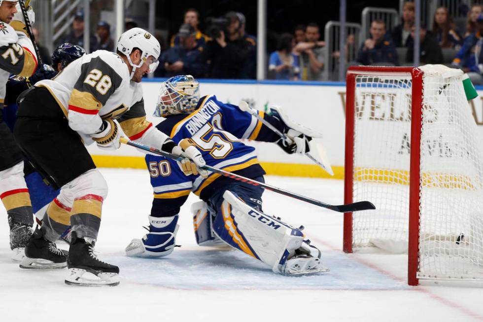 Vegas Golden Knights' William Carrier (28) scores past St. Louis Blues goaltender Jordan Binnin ...