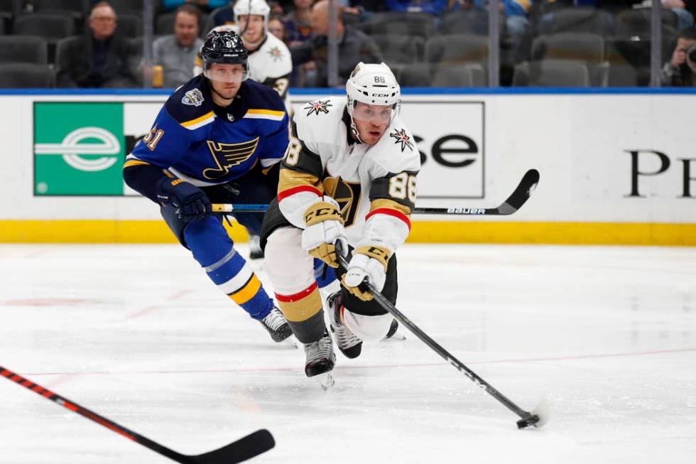 Vegas Golden Knights' Nate Schmidt (88) passes as St. Louis Blues' Jacob de la Rose, of Sweden, ...