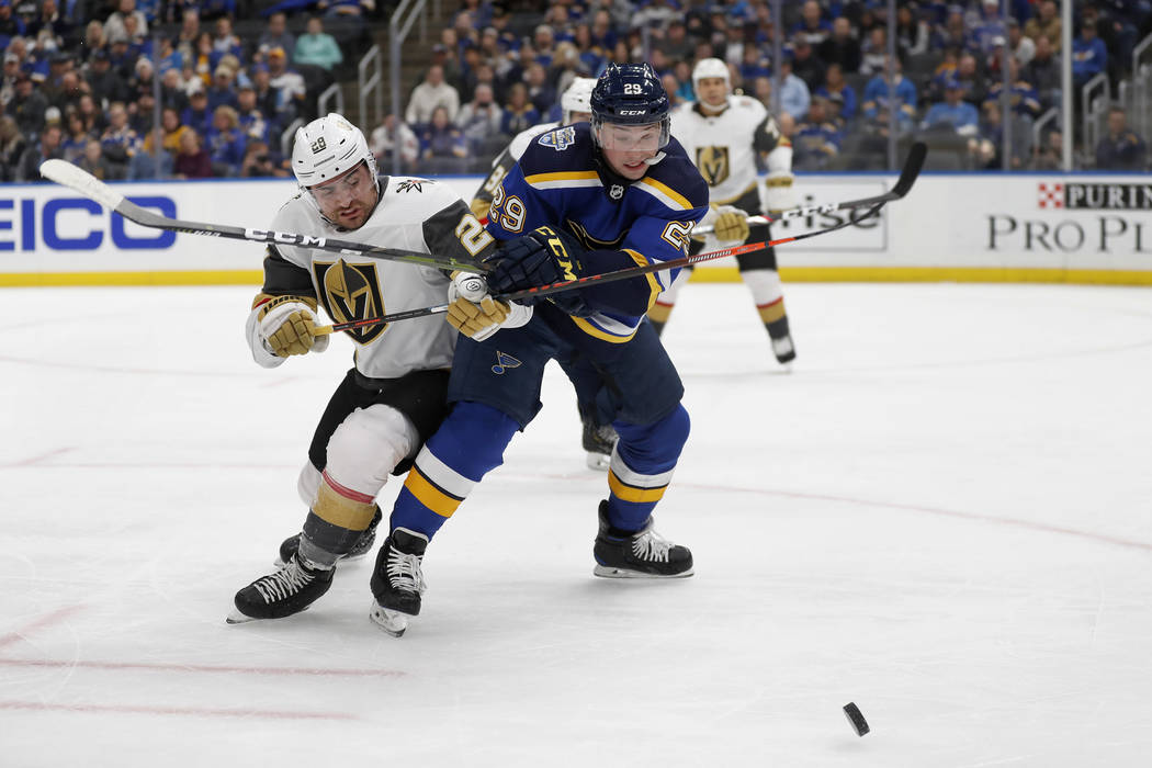 Vegas Golden Knights' William Carrier, left, and St. Louis Blues' Vince Dunn (29) chase afterth ...