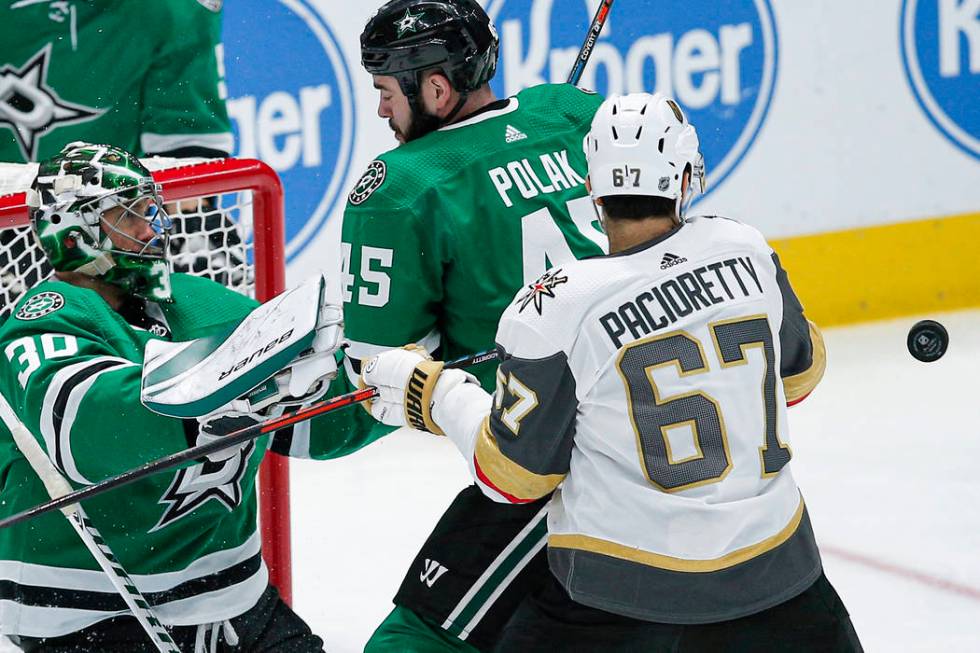 Vegas Golden Knights forward Max Pacioretty (67) battles Dallas Stars goaltender Ben Bishop (30 ...