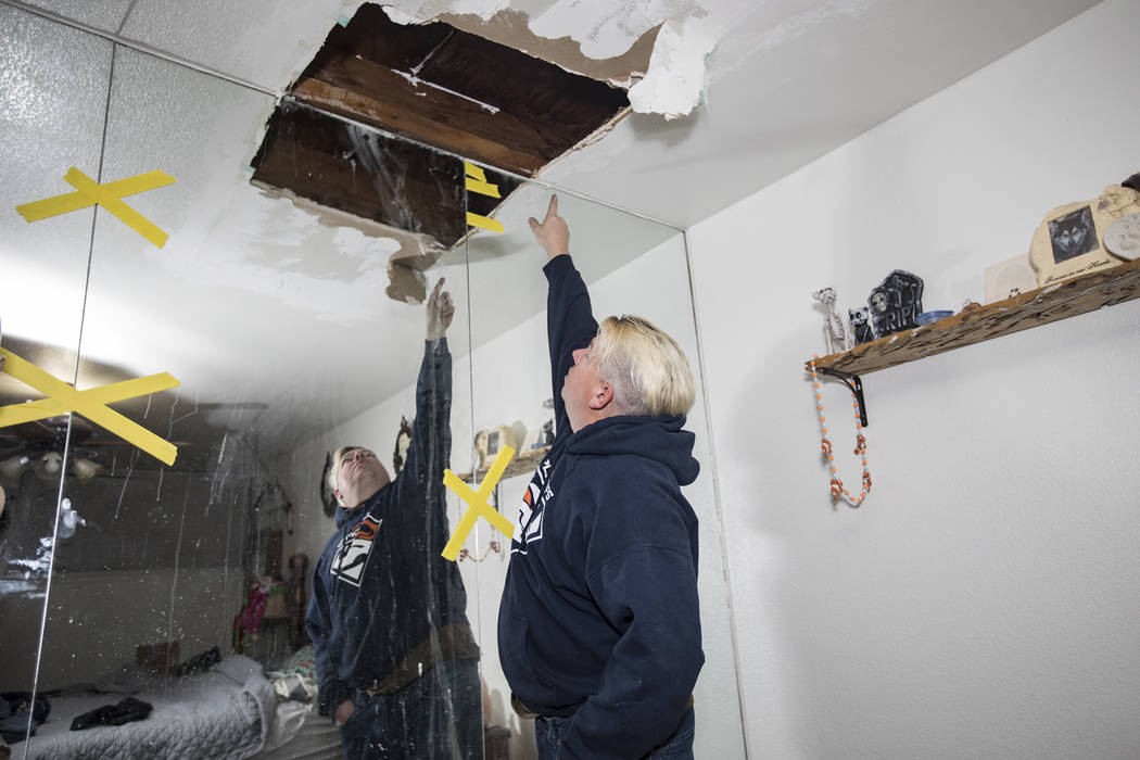 John Bodimer shows the Review-Journal where a leak in the roof of his Las Vegas rental home is ...