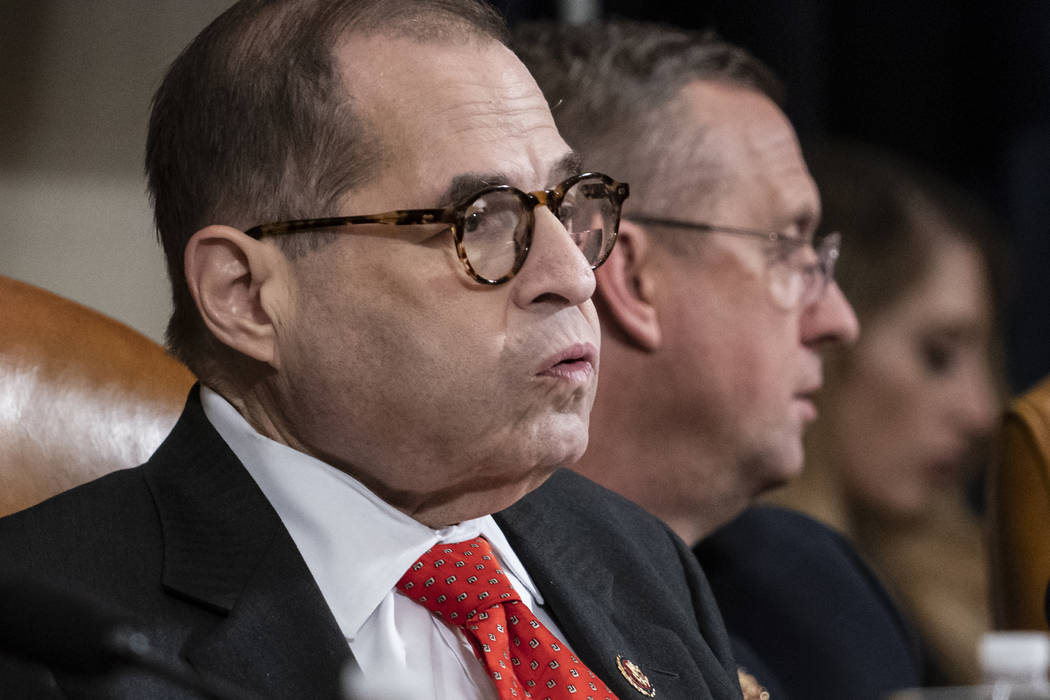 House Judiciary Committee Chairman Jerrold Nadler, D-N.Y., left, exhales after a day of work wi ...