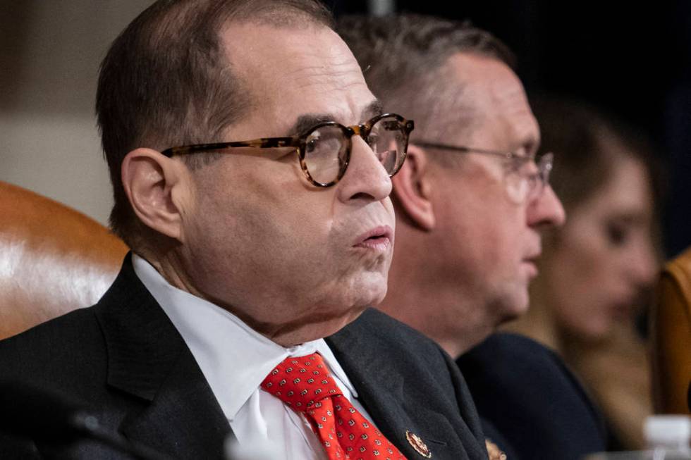 House Judiciary Committee Chairman Jerrold Nadler, D-N.Y., left, exhales after a day of work wi ...