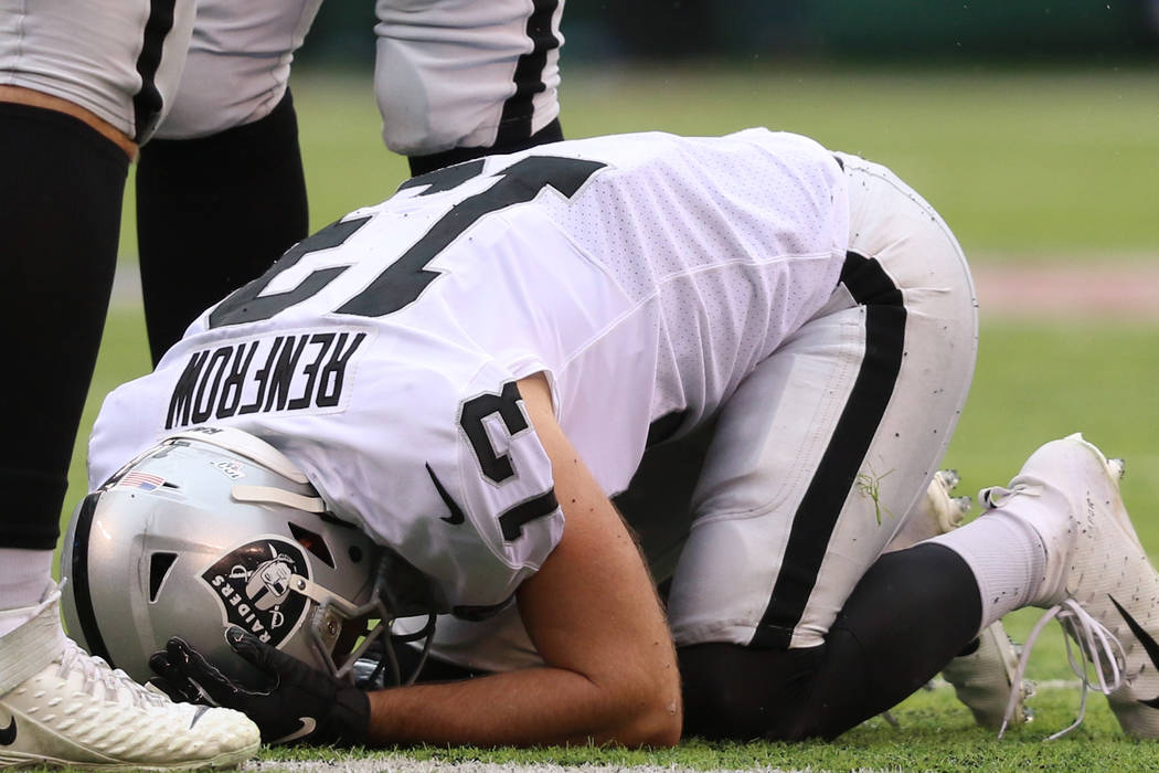 Oakland Raiders wide receiver Hunter Renfrow (13) remains on the field after being hit by New Y ...