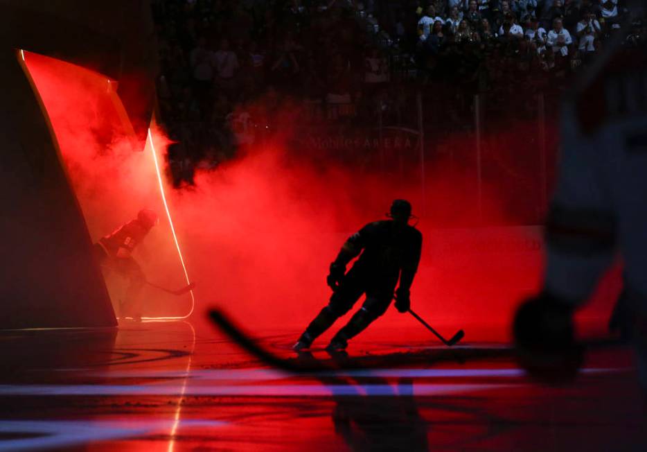 Golden Knights players take the ice for the start of an NHL hockey game against the Carolina Hu ...