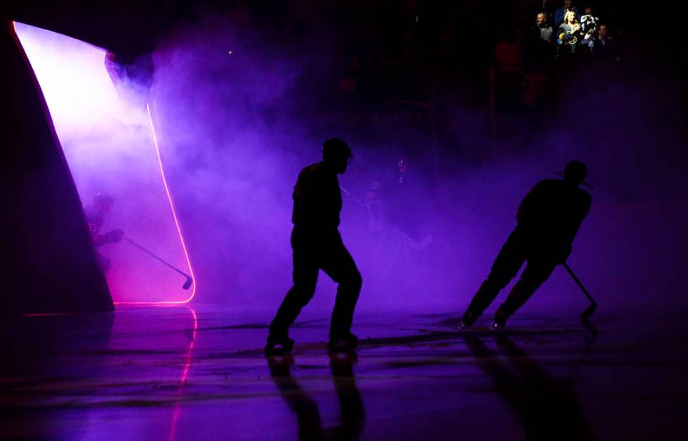 Golden Knights players and referees take the ice before the start of an NHL hockey game against ...