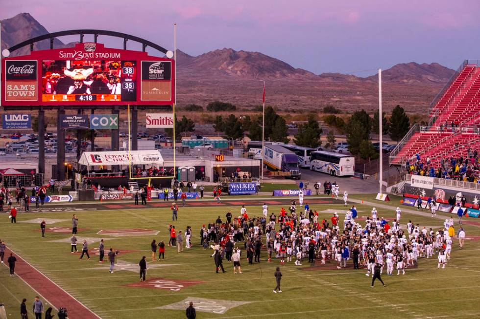 UNLV Rebels and San Jose State Spartans players and coaches come together on the field followin ...