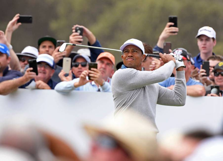 U.S. team player and captain Tiger Woods tees off on the 5th hole in their foursomes match duri ...