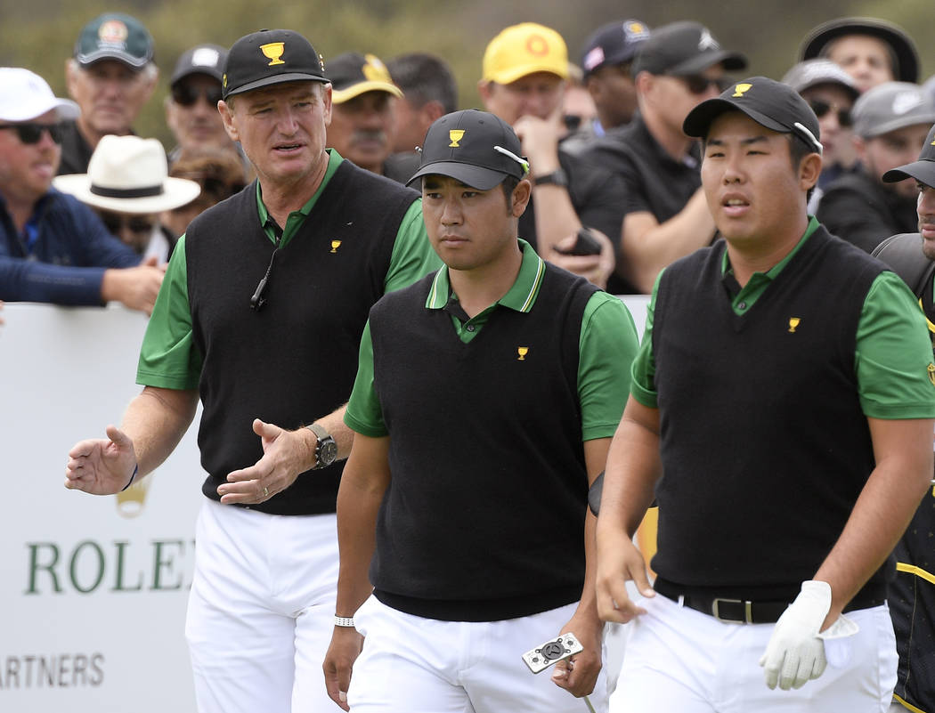 International team captain Ernie Els, left, Hideki Matsuyama of Japan and Byeong Hun An of Sout ...