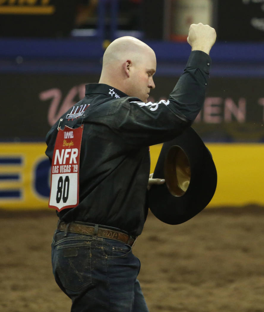 Will Lummus of West Point, Miss. celebrates his score after Steer Wrestling during Bareback Rid ...