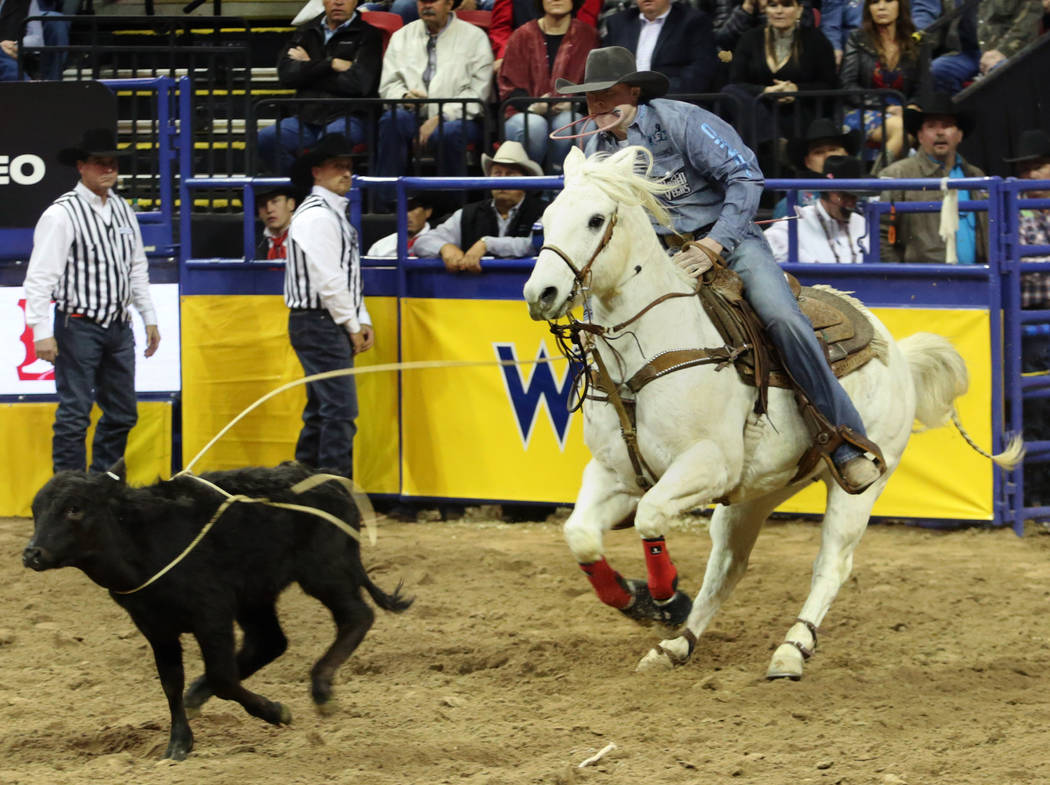Riley Pruitt of Gering, Neb. competes in Tie-down Roping in the eighth go-round of the Wrangler ...