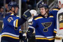 St. Louis Blues' Robert Thomas, right, is congratulated by David Perron (57) after scoring duri ...