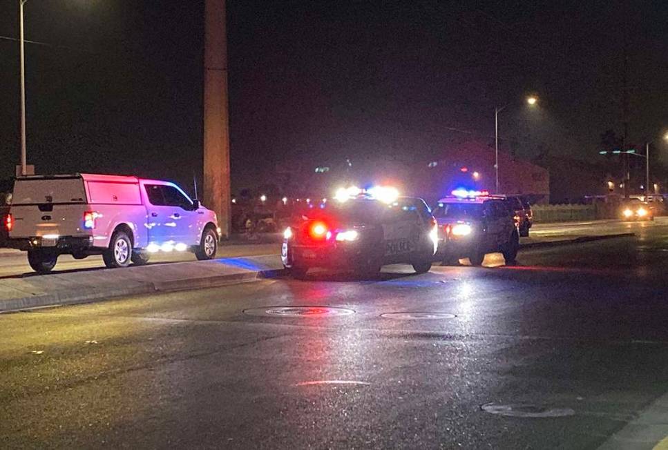 Police units block traffic near East Lake Mead Boulevard and North Pecos Road after a two-vehic ...