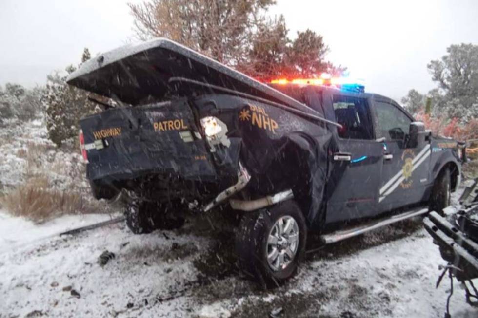 This photo shows the aftermath of a crash between a sport utility vehicle and a state trooper v ...