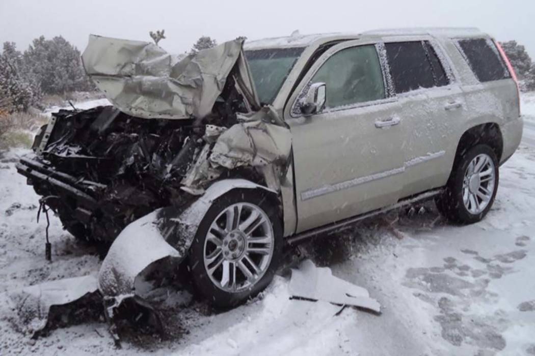 This photo shows the aftermath of a crash between a sport utility vehicle and a state trooper v ...