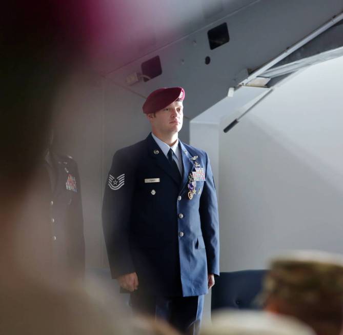 Technical Sgt. Gavin Fisher stands for applause after receiving the Purple Heart and Silver Sta ...