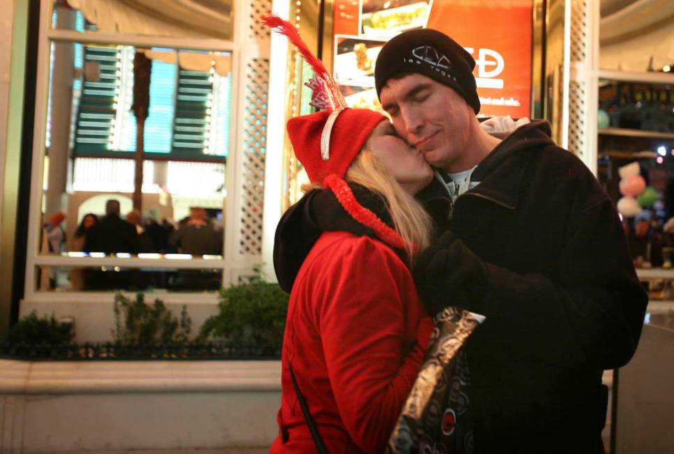 A couple embraces moments before 2011 arrives at the Fremont Street Experience in Las Vegas. (J ...