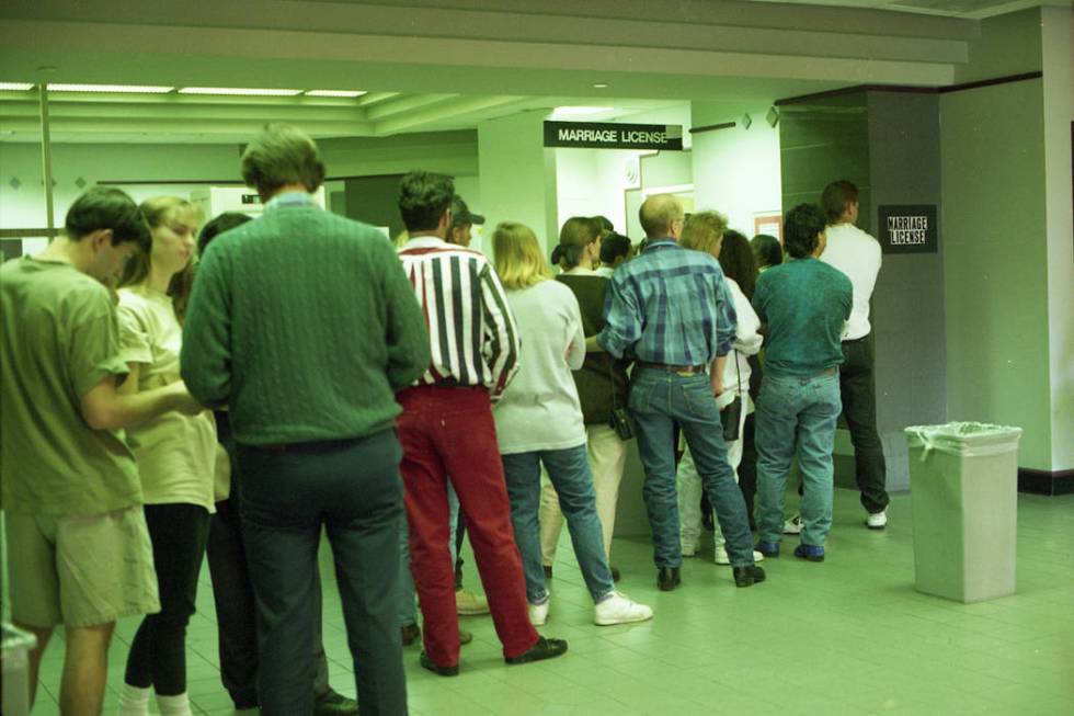 People seeking 1993 New Year's Eve nuptials stand in line at the Clark County Marriage License ...