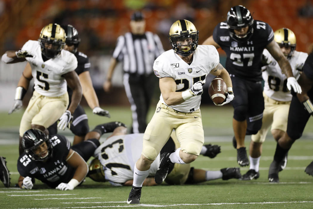 Army running back Connor Slomka (25) cuts through the Hawaii defense for a touchdown during the ...