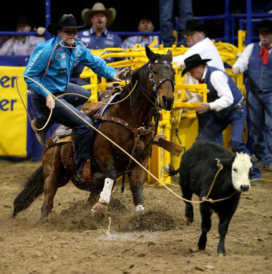 Marty Yates of Stephenville, Texas competes in Tie-Down Roping during the ninth go-around of th ...