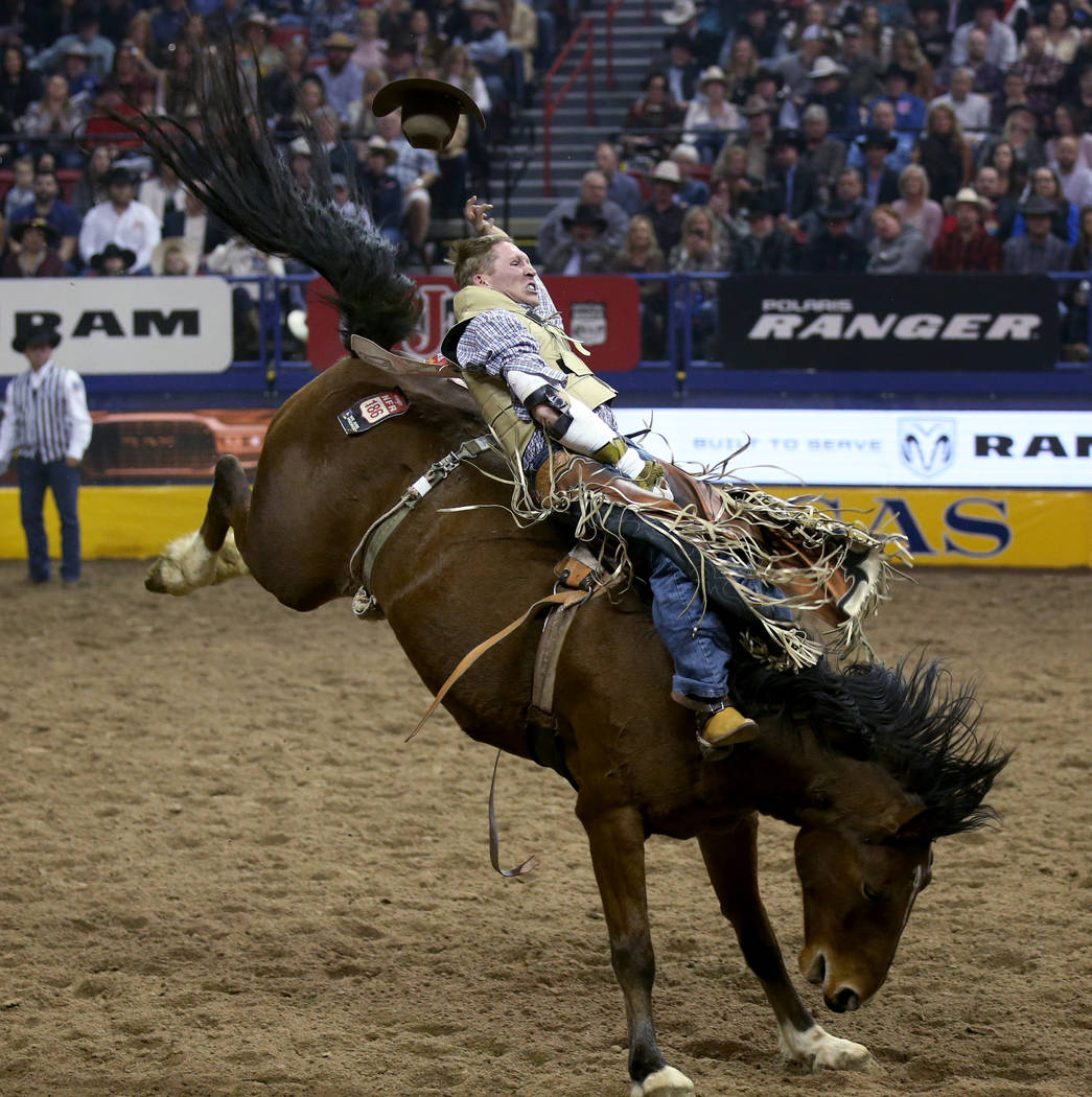Ty Breuer of Mandan, N.D. rides Pickup Sticks in the Bareback Riding competition during the nin ...