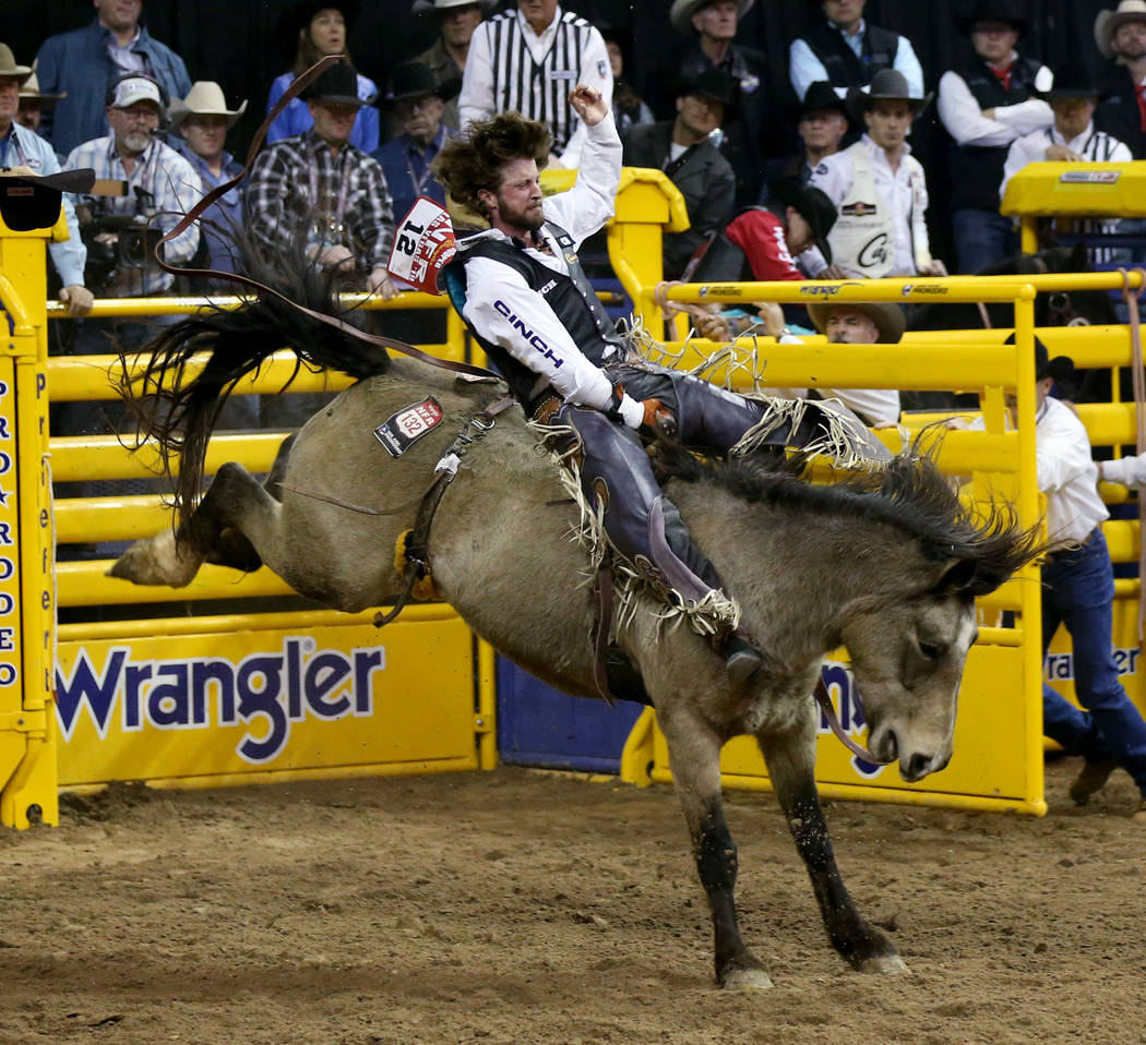 Tilden Hooper of Carthage, Texas rides Night Fist in the Bareback Riding competition during the ...