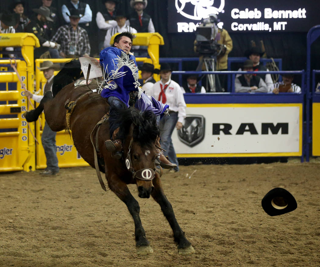 Caleb Bennett of Corvallis, Mont. rides Control Freak in Bareback Riding during the ninth go-ar ...