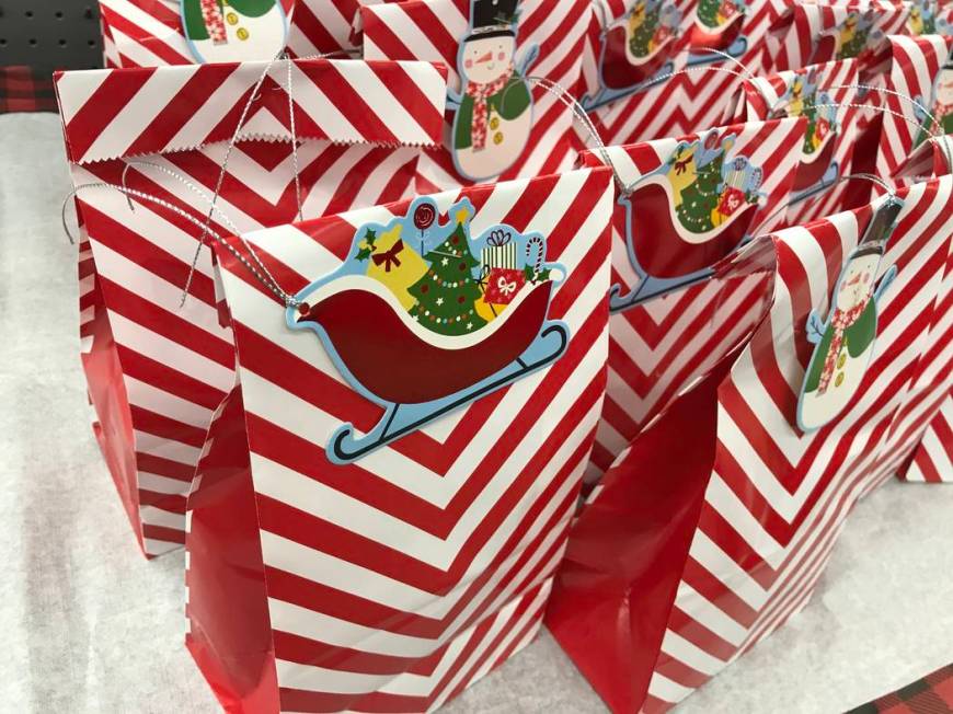 Goodie bags for children are on display during a "Santa Cops" event on Saturday, Dec. 14, 2019, ...