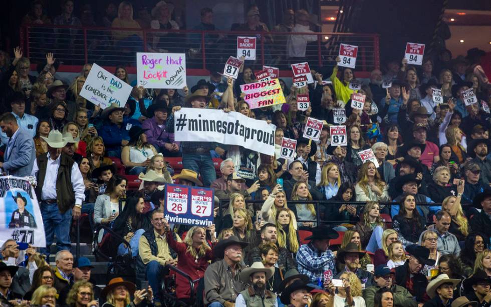 Fans cheer for their competitors during the tenth go round of the Wrangler National Finals Rode ...