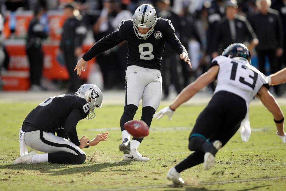 Oakland Raiders kicker Daniel Carlson (8) kicks a field goal as Jacksonville Jaguars wide recei ...