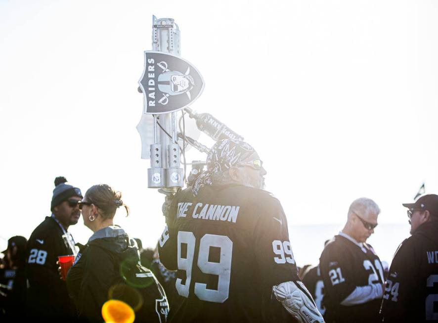 "The Cannon" tailgates outside the Oakland Coliseum before the start of an NFL footba ...